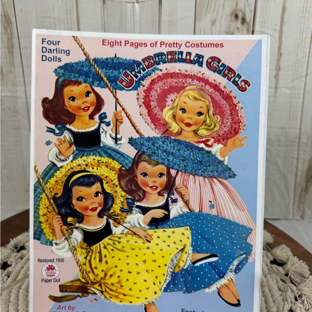 Vintage Umbrella Girls Paper Doll.Eight pages of pretty costumes